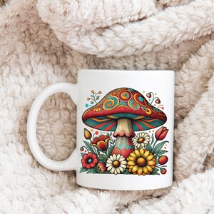 May include: White ceramic mug with a colorful psychedelic mushroom and flowers design. The mushroom has a red cap with blue and green swirls and a white stem. The flowers are yellow, red, and orange.