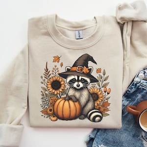 Mignon raton laveur chemise PNG raton laveur citrouille conception PNG raton laveur sauvage sublimation image rétro Halloween PNG tendance automne conception chapeau de sorcière tournesol