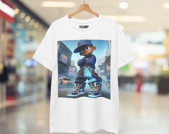 May include: White t-shirt featuring a cartoon illustration of a young person in a blue hat and outfit, standing confidently on a city street. The graphic includes buildings, a bus, and colorful graffiti.