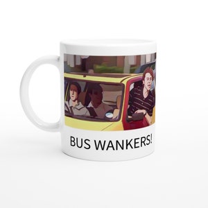 May include: White ceramic mug featuring a cartoon image of three people in a yellow car. The mug has the text "BUS WANKERS!" printed in black, bold letters. The mug has a white handle.