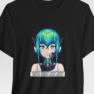 May include: Black t-shirt featuring a digital anime-style graphic of a cyborg with blue and green hair and binary code at the bottom. The cyborg has teal eyes and a partially robotic face.
