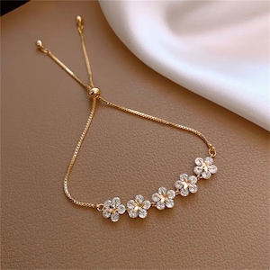 Sparkly flower and star  bracelet , gem, gift, for mum , friend, sister , bridesmaid , wedding , adjustable, cute,romantic, beautiful gold