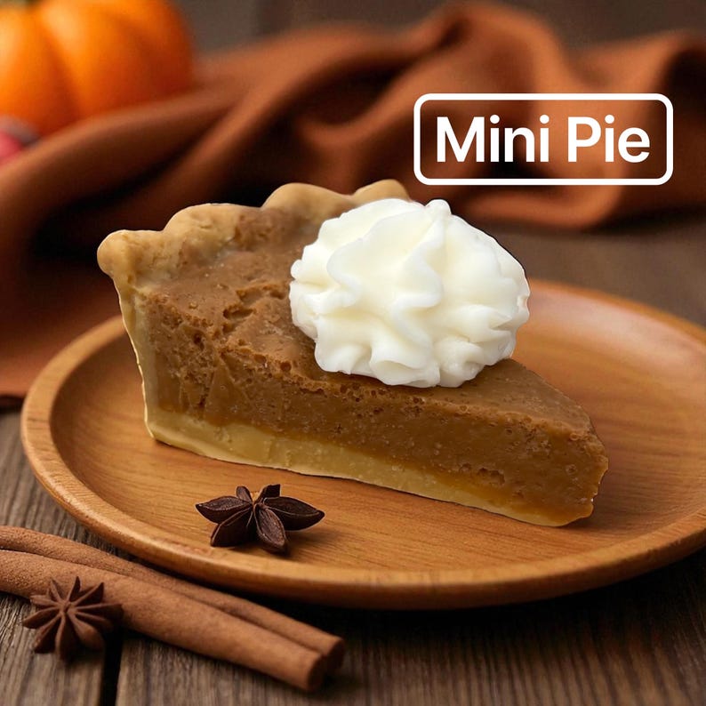May include: A slice of mini pie on a wooden plate, topped with whipped cream. The pie has a golden crust and a brown filling. Cinnamon sticks and star anise are placed near the plate. The text "Mini Pie" is in a white box.