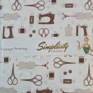 May include: White fabric featuring a repeating pattern of brown vintage sewing tools. The design includes scissors, sewing machines, spools of thread, dress forms, and the words "Simplicity Vintage Sewing".