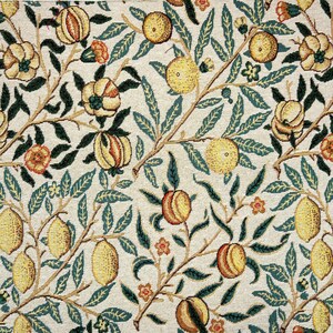 May include: A vintage tapestry featuring a repeating pattern of stylized lemons, pomegranates, and leaves in shades of yellow, green, and orange on a cream background.