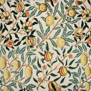 May include: A vintage tapestry featuring a repeating pattern of stylized lemons, pomegranates, and leaves in shades of yellow, green, and orange on a cream background.