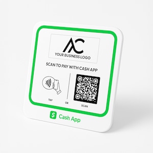 May include: White square sign with a green border. The sign has a black logo with the letters "AC" and the text "YOUR BUSINESS LOGO". Below the logo is the text "SCAN TO PAY WITH CASH APP". There are two icons below the text. The left icon shows a phone with a wave symbol and a hand holding the phone. The text "TAP" is below the icon. The right icon is a QR code. The text "SCAN" is below the icon. The text "OR" is between the two icons. The bottom of the sign has the text "$ Cash App" in green.