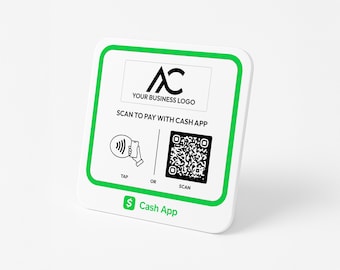 May include: White square sign with a green border. The sign has a black logo with the letters "AC" and the text "YOUR BUSINESS LOGO". Below the logo is the text "SCAN TO PAY WITH CASH APP". There are two icons below the text. The left icon shows a phone with a wave symbol and a hand holding the phone. The text "TAP" is below the icon. The right icon is a QR code. The text "SCAN" is below the icon. The text "OR" is between the two icons. The bottom of the sign has the text "$ Cash App" in green.
