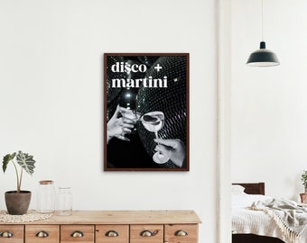 May include: A black and white photograph of two hands holding martini glasses, with a disco ball in the background. The text "disco + martini" is printed in white on a black background.