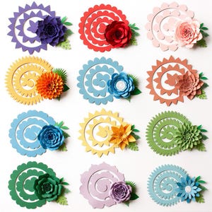 May include: A collection of colorful paper flowers, each with a unique spiral design and a central floral element. The flowers are in various colors, including purple, red, pink, yellow, blue, and green, with green leaf accents.