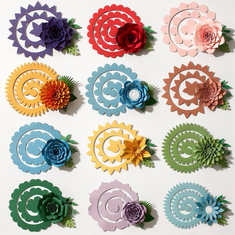May include: A collection of colorful paper flowers in various designs. Each flower features a spiral or circular base with a contrasting paper flower and green leaf accents. Colors include purple, red, pink, yellow, blue, brown, green, and light blue.