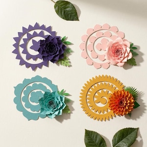 May include: Four colorful paper flower arrangements. Each arrangement features a central paper flower, such as a rose or dahlia, with green paper leaves. The arrangements are in shades of purple, pink, teal, and yellow, with a white background.