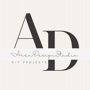 May include: A logo design featuring the letters "AD" in a bold, dark gray font. Below the letters, the words "Aren Design Studio" are written in a cursive font, with "DIY PROJECTS" below in a smaller, sans-serif font. The background has a vertical striped pattern.