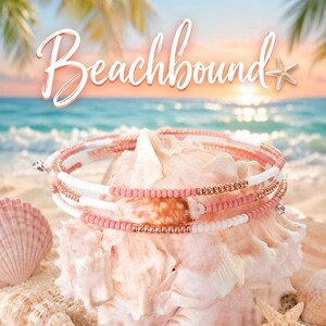 May include: A multi-strand bracelet featuring alternating white and coral-colored beads with metallic rose gold accents. The bracelet is wrapped around a large, textured, light-colored seashell. The text Beachbound is visible above.
