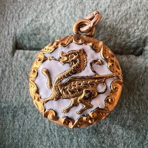 Antique gold tone griffin charm