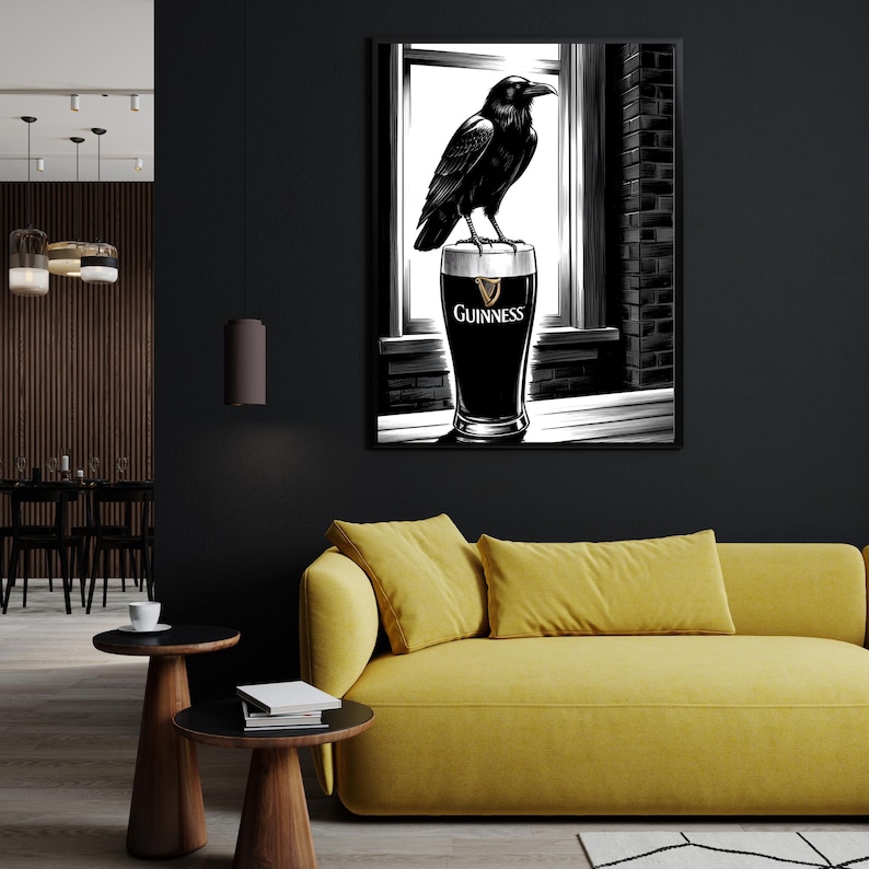 May include: A black raven perched on top of a glass of Guinness beer. The raven is looking to the right. The glass is on a white surface. The background is a black and white illustration of a brick wall and a window.