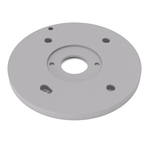 Peut inclure: Une plaque de montage circulaire gris clair dotée d'une grande ouverture centrale, de deux petits trous filetés près du centre et de quatre trous périphériques de formes variées, dont une fente allongée pour une installation réglable.