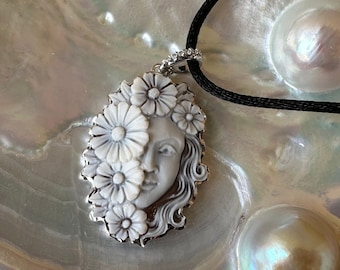 Genuine Italian cameo on sardonic shell hand engraved and set in solid 925 silver. Handmade jewelry in Italy.