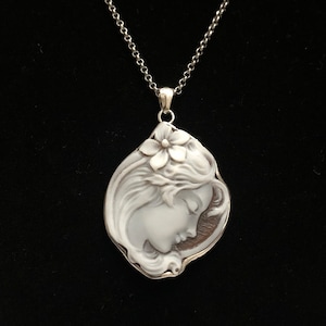 Sardonyx cameo with a woman's profile and flower, set in a solid rhodium-plated silver frame and chain. Handmade in Italy