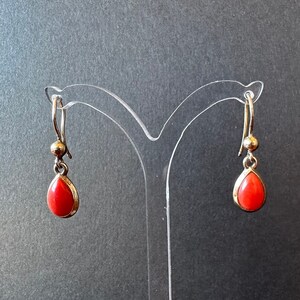 Gold-plated brass earrings with real red Mediterranean coral "spools". Handmade jewelry in Italy.