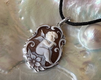 Genuine Italian cameo on sardonic shell with "angel" engraving, set in solid silver. Handmade jewelry in Italy.