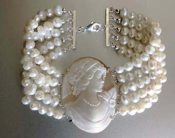 5-strand bracelet with real baroque pearls and "madame" cameo set. Settings and clasps in 925 silver. Handmade in Italy.