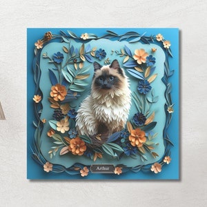May include: A paper art portrait of a cat named Arthur, surrounded by blue, orange, and green paper flowers. The cat is sitting in the center of the artwork, with its head tilted to the side. The background is a light blue color.