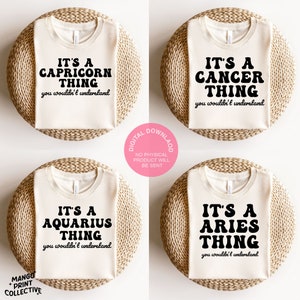 May include: Four white t-shirts with black text. Each shirt features a different zodiac sign: Capricorn, Cancer, Aquarius, and Aries. The text reads "It's a [Zodiac Sign] Thing you wouldn't understand."