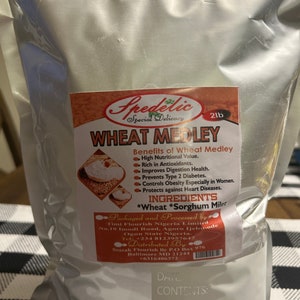 May include: A silver bag of "Wheat Medley" with a red and orange label. The label lists health benefits and ingredients, including wheat and sorghum. The bag contains 2 pounds of product.