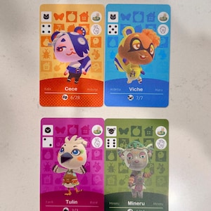 May include: Four rectangular trading cards featuring Animal Crossing characters. Top left is orange with Cece, top right is blue with Viche, bottom left is magenta with Tulin, and bottom right is green with Mineru. Each card displays icons, names, and numbers.