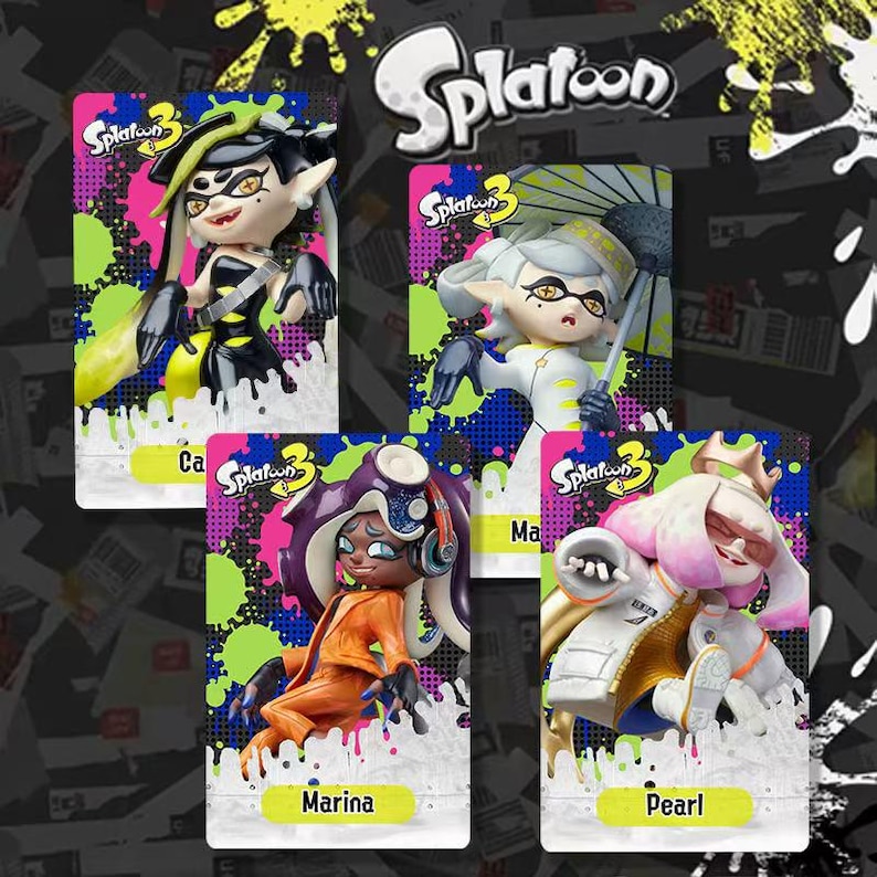 May include: Four character figures from the video game Splatoon 3 are displayed on cards. The figures are in various poses and outfits, with vibrant colors and details. The cards have the Splatoon 3 logo and character names.