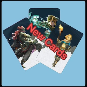 May include: Three rectangular playing cards featuring illustrated characters from a video game. The cards display a green-skinned warrior, a blonde character holding a torch, and a figure with glowing hands. The text New Cards is printed in red.