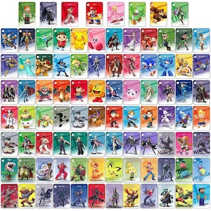 May include: A collection of rectangular trading cards featuring various video game characters from the Super Smash Bros series. Each card displays a unique character illustration with a colored background, character name, and a small circular icon.