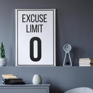 May include: A modern interior scene featuring a gray dresser, a round-backed chair, and a framed print with the text "EXCUSE LIMIT 0." A small clock, books, and a potted plant are on a shelf above the dresser.