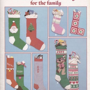 May include: Seven different styles of Christmas stockings to knit or crochet. The stockings are decorated with various themes, including Santa, a Christmas tree, a teddy bear, and a snowman. The stockings are all made with colourful yarn and have a variety of textures.