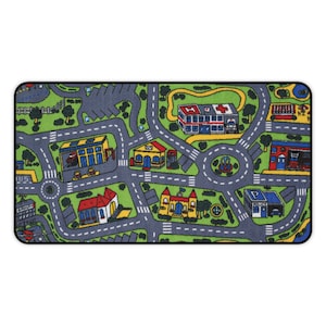 Mousepad with a colorful 90s/2000s-style city street carpet design, featuring winding roads, buildings, and trees on a blank white background.