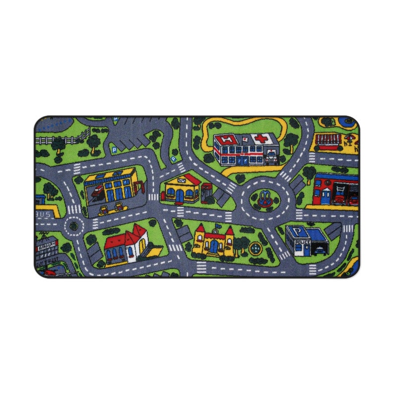 Mousepad with a colorful 90s/2000s-style city street carpet design, featuring winding roads, buildings, and trees on a blank white background.