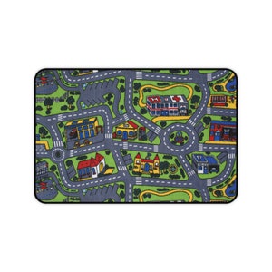 Mousepad with a colorful 90s/2000s-style city street carpet design, featuring winding roads, buildings, and trees on a blank white background.