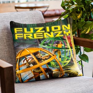 May include: A pillow with a colorful graphic of two figures in cages. The text "FUZION FRENZY" is printed in yellow on a green background.