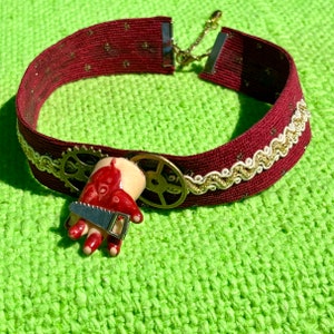 Unique velvet choker necklace oddity jewelry with bloody doll hand