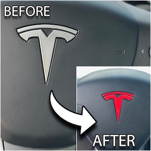 May include: Image comparison of a car steering wheel emblem. The "BEFORE" image shows a silver emblem, while the "AFTER" image shows a red emblem. The text "BEFORE" and "AFTER" are visible in the image.