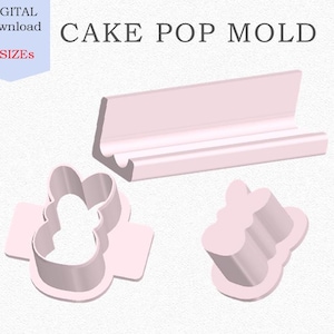 May include: Three pink plastic cake pop molds. The molds are shaped like a bunny, a flower, and a rectangle. The molds are designed to create cake pops in three different sizes. The text "CAKE POP MOLD" is printed in black on a white background.