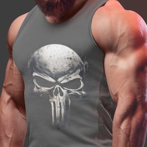 May include: A gray tank top with a white skull graphic. The skull has a menacing expression and is detailed with black lines. The tank top is worn by a muscular man with a beard.
