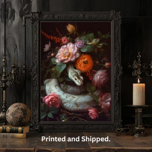 May include: A framed print of a still life featuring a white snake coiled around a bouquet of pink, red, and white flowers. The flowers are arranged in a dark green vase. The background is a dark green.