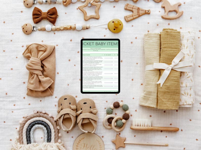 May include: A collection of baby items, including a bow, pacifier, wooden toys, a headband, baby shoes, a rainbow wall hanging, a wooden teether, a brush, and swaddling blankets. A tablet displays a list titled "TICKET BABY ITEMS". The items are in neutral tones.