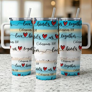May include: Three stainless steel tumblers with a blue and white ombre design. The tumblers feature the text "love binds us together" and "Colossians 3:14" repeated throughout the design. The tumblers have a clear lid and a handle.