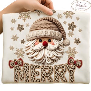 May include: A cream-colored Christmas-themed pillow featuring a Santa Claus design with a crocheted hat and beard. The word "MERRY" is spelled out in leopard print letters. The design includes snowflakes and leopard print stars.