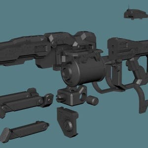 Könnte beinhalten: Ein dunkelgrauer, zerlegter Sci-Fi-Gewehr-Modellbausatz mit einer Hauptlaufbaugruppe, einem zylindrischen Magazin, einem Schaft und verschiedenen modularen Komponenten, die in einer Explosionszeichnung vor einem gedeckten blauen Hintergrund angeordnet sind.