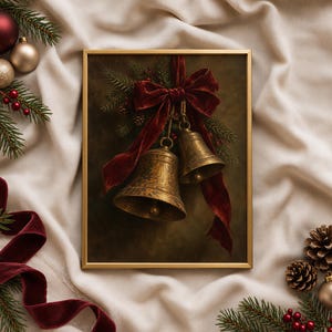 May include: A framed wall art print featuring two antique brass bells tied with a deep red velvet ribbon, accented by pine branches and small red berries, set against a dark, moody background within a thin gold frame.