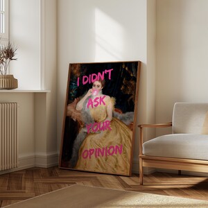 May include: A vintage portrait of a woman with a pink bubble gum in her mouth. The text "I DIDN'T ASK YOUR OPINION" is written in pink over the image.
